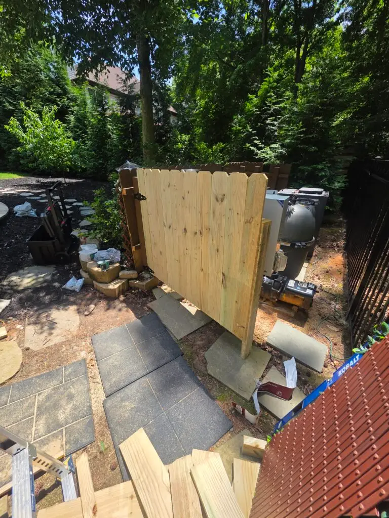 Fence Construction for Pool Equipment Enclosure in Charlotte — camouflaged fence