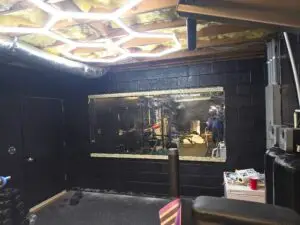 Mirror and Lighting Installation in Locust — custom wooden supports